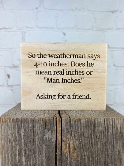 Funny "Man Inches" Sign