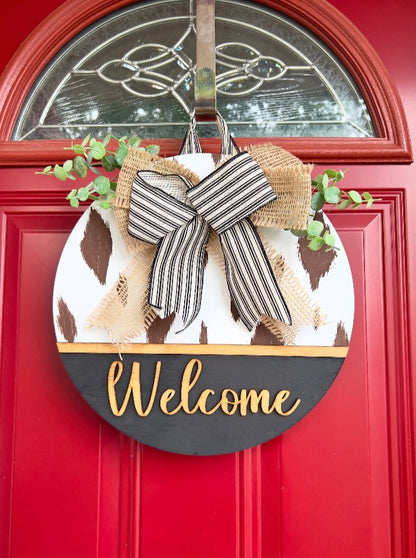 Cow print welcome door hanger